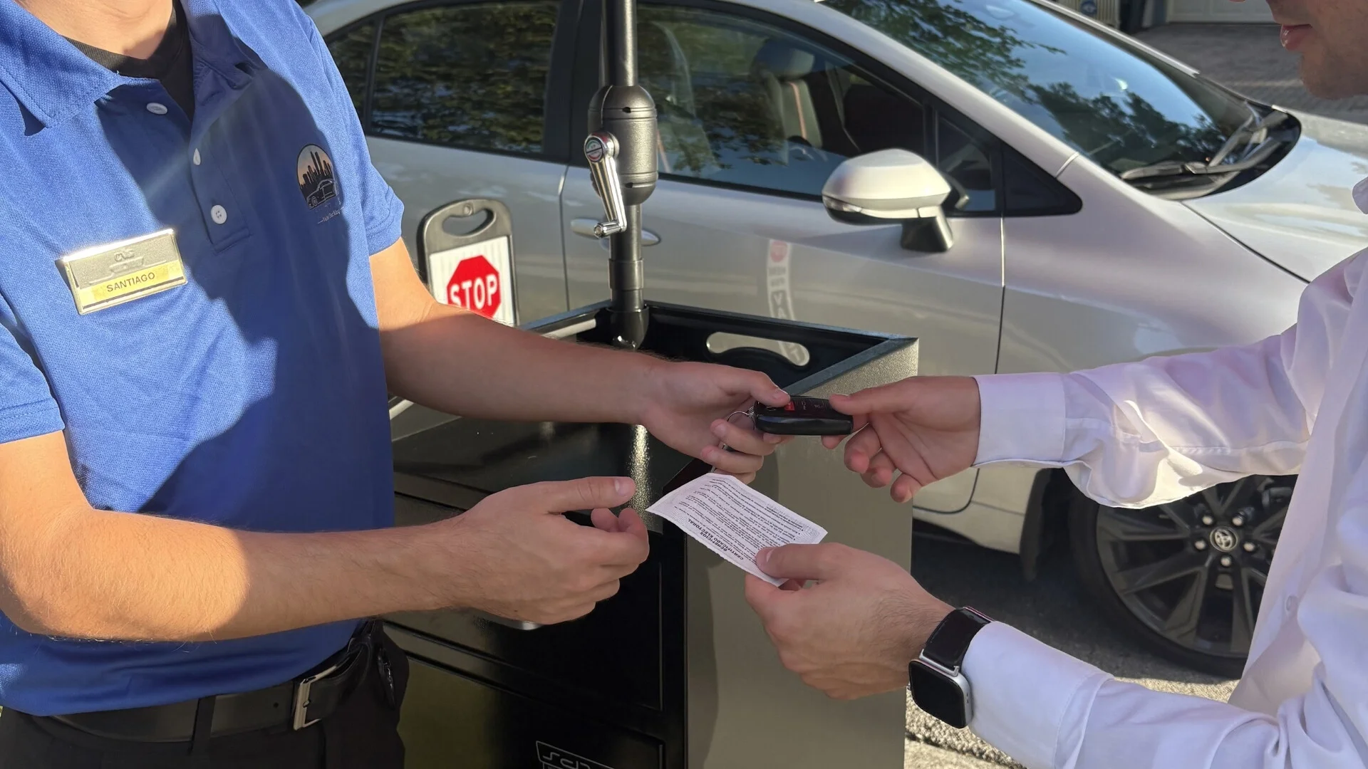 Valet ticket and key handoff at an event